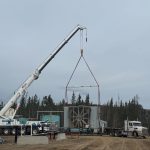 Donald Rigging’s specialized transportation crew lifts a 176,000-lb compressor to ready it for transport.